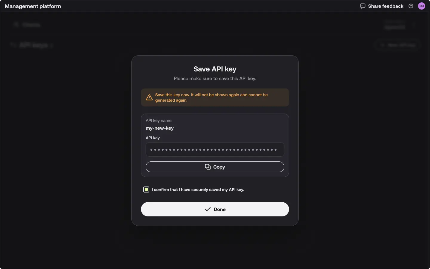 The Save API key dialog. It warns that the key will not be shown again, displays the generated key with a Copy button, and requires confirming that the key has been saved before selecting Done.